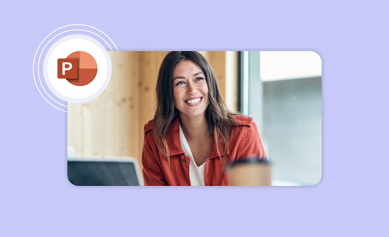 A woman in an office smiling with the PowerPoint logo in the top left of the screen.